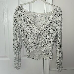 I’m selling this white top with black speckles all over in a size medium!